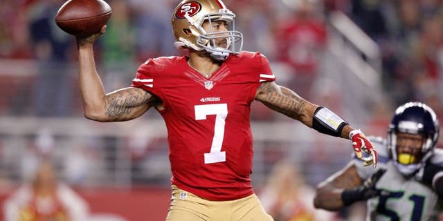 Nov 27, 2014; Santa Clara, CA, USA; San Francisco 49ers quarterback Colin Kaepernick (7) prepares to throw a pass against the Seattle Seahawks in the fourth quarter at Levi's Stadium. The Seahawks defeated the 49ers 19-3. Mandatory Credit: Cary Edmondson-USA TODAY Sports
