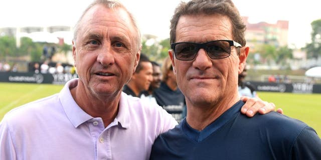 KUALA LUMPUR, MALAYSIA - MARCH 25: Johan Cruyff coach of Team YR1M and Fabio Capello coach of Team Laureus pose during the Laureus All Stars Unity Cup ahead of the 2014 Laureus World Sports Awards at Royal Selangor Club on March 25, 2014 in Kuala Lumpur, Malaysia. (Photo by Mike Hewitt/Getty Images for Laureus)
