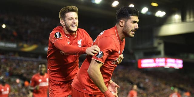 LIVERPOOL, ENGLAND - OCTOBER 22: Emre Can (R) of Liverpool is congratulated by teammate Adam Lallana of Liverpool after scoring a goal to level the scores at 1-1 during the UEFA Europa League Group B match between Liverpool FC and Rubin Kazan at Anfield on October 22, 2015 in Liverpool, United Kingdom. (Photo by Michael Regan/Getty Images)
