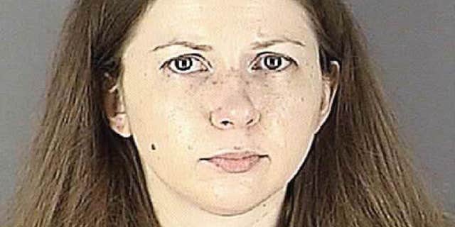 This undated photo provided by the Hennepin County Jail, shows a booking mug of Carrie Pernula.