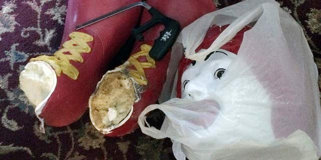 Oct. 22, 2015: This photo provided by Ronald McDonald House Charities, shows the decapitated head and feet from the Ronald McDonald statue that sits on a bench outside the Ronald McDonald House in Burlington, Vt.