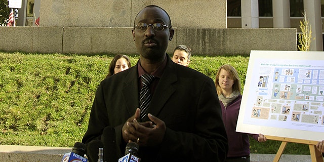 Oct. 19: Claude Rwaganje, a resident of Portland, Maine, for more than 13 years, speaks at a news conference. Portland residents will vote in November on a proposal that would give legal residents who are not U.S. citizens the right to vote in local elections.
