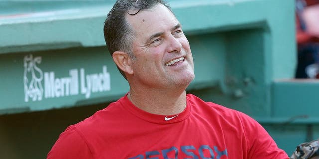 BOSTON, MA - AUGUST 19: John Farrell #53 of the Boston Red Sox makes a visit to the dugout before a game against the Cleveland Indians at Fenway Park on August 19, 2015 in Boston, Massachusetts. Last week, Farrell relinquished his duties as manager to undergo treatment for lymphoma. (Photo by Jim Rogash/Getty Images)
