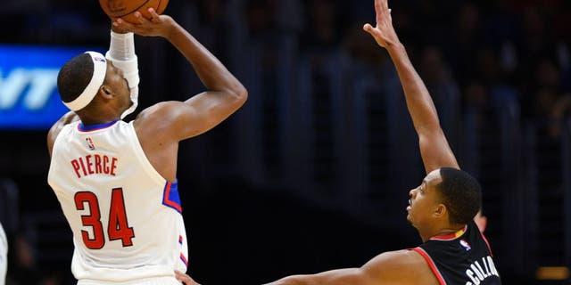 Los Angeles Clippers Paul Pierce shoots as Portland Trail Blazers CJ McCollum defends during the fourth quarter of an NBA preseason basketball game in Los Angeles, Thursday, Oct. 22, 2015. The Clippers won 115-109. (AP Photo/Kelvin Kuo)
