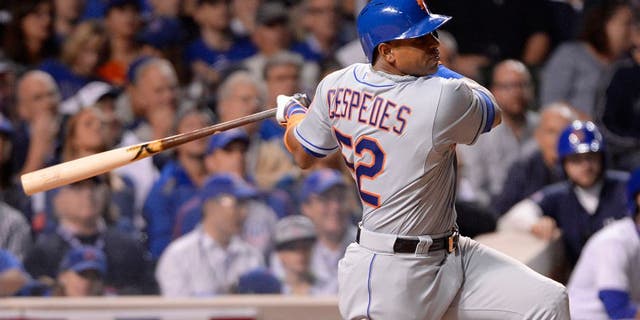 CHICAGO, IL - OCTOBER 20: Yoenis Cespedes #52 of the New York Mets singles in the top of the sixth inning of Game 3 of the NLCS against the Chicago Cubs at Wrigley Field on Tuesday, October 20, 2015 in Chicago , Illinois. (Photo by Ron Vesely/MLB Photos via Getty Images)