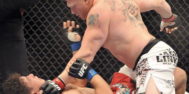 LAS VEGAS - JULY 11: UFC heavyweights Brock Lesnar (R) battles Frank Mir (L) during their heavyweight title bout during UFC 100 the Mandalay Bay Hotel and Casino on July 11, 2009 in Las Vegas, Nevada. (Photo by Jon Kopaloff/Getty Images)
