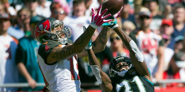 Oct 11, 2015; Tampa, FL, USA; Jacksonville Jaguars cornerback Davon House (31) breaks up a pass intended for Tampa Bay Buccaneers wide receiver Mike Evans (13) in the third quarter at Raymond James Stadium. The Tampa Bay Buccaneers won 38-31. Mandatory Credit: Logan Bowles-USA TODAY Sports
