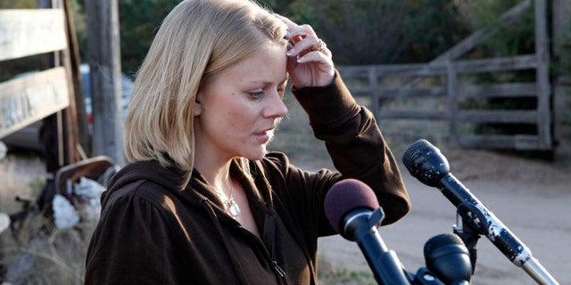 Oct. 23: Tiffany Hartley talks with the media at her parents home in LaSalle, Colo., after riding with them from Texas.
