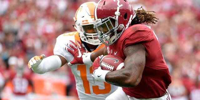 Oct 24, 2015; Tuscaloosa, AL, USA; Alabama Crimson Tide running back Derrick Henry (2) carries for a touchdown against Tennessee Volunteers defensive back Malik Foreman (13) during the first quarter at Bryant-Denny Stadium. Mandatory Credit: John David Mercer-USA TODAY Sports