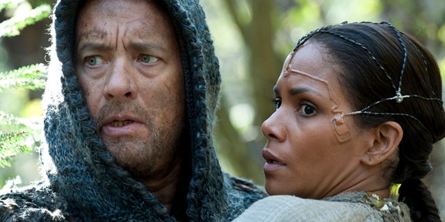 This film image released by Warner Bros. Pictures shows Tom Hanks as Zachry and Halle Berry as Meronym in a scene from "Cloud Atlas."