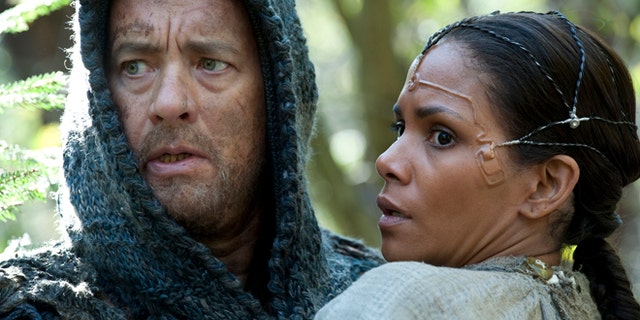 This film image released by Warner Bros. Pictures shows Tom Hanks as Zachry and Halle Berry as Meronym in a scene from "Cloud Atlas."
