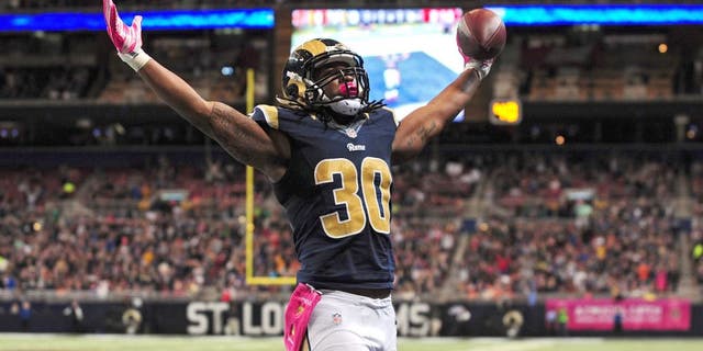 Oct 25, 2015; St. Louis, MO, USA; St. Louis Rams running back Todd Gurley (30) celebrates after scoring a one yard touchdown against the Cleveland Browns during the second half at the Edward Jones Dome. St. Louis defeated Cleveland 24-6. Mandatory Credit: Jeff Curry-USA TODAY Sports