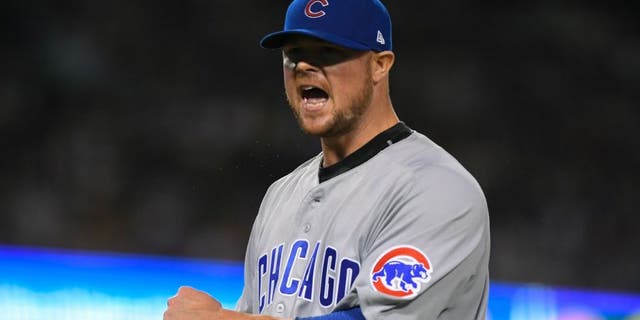 Chicago Cubs starting pitcher Jon Lester reacts after getting out of the seventh inning of Game 5 of the National League baseball championship series against the Los Angeles Dodgers Thursday, Oct. 20, 2016, in Los Angeles. (AP Photo/Mark J. Terrill)