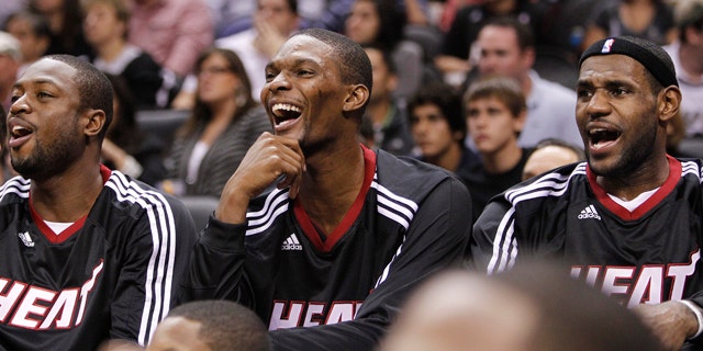 Oct. 9: Miami Heat's Dwyane Wade, left, Chris Bosh, center, and LeBron James react on the bench during the second quarter of an NBA preseason basketball game against the San Antonio Spurs in San Antonio.