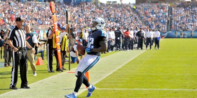 Oct 26, 2014; Nashville, TN, USA; Tennessee Titans tight end Delanie Walker (82) catches a pass and rushes for a touchdown against the Houston Texans during the second half at LP Field. Texans won 30-16. Mandatory Credit: Jim Brown-USA TODAY Sports