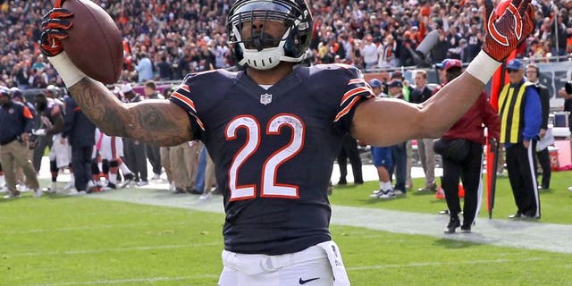 CHICAGO, IL - OCTOBER 19: Matt Forte #22 of the Chicago Bears celebrates his touchdown during the third quarter of a game against the Miami Dolphins at Soldier Field on October 19, 2014 in Chicago, Illinois. (Photo by Jonathan Daniel/Getty Images)