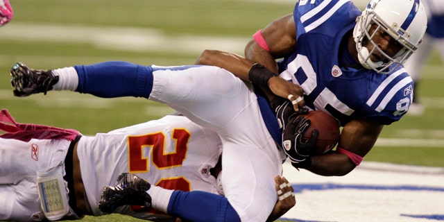 Oct. 10: Indianapolis Colts wide receiver Pierre Garcon, right, is tackled by Kansas City Chiefs defensive back Eric Berry during the second half of an NFL football game in Indianapolis.