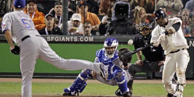 Oct. 27: Giants' Juan Uribe hits a three-run home run during the fifth inning of Game 1 in San Francisco.