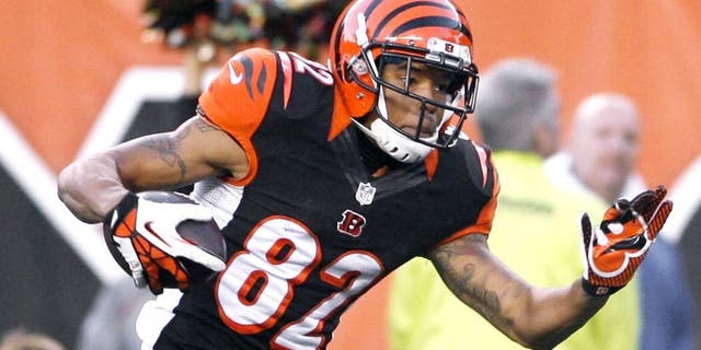 Oct 27, 2013; Cincinnati, OH, USA; Cincinnati Bengals wide receiver Marvin Jones (82) runs the ball against the New York Jets at Paul Brown Stadium. Cincinnati defeated New York 49-9. Mandatory Credit: Mark Zerof-USA TODAY Sports