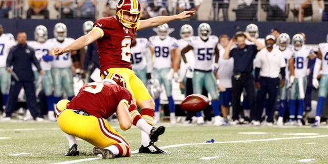 Oct 27, 2014; Arlington, TX, USA; Washington Redskins kicker Kai Forbath (2) kicks a field goal in overtime against the Dallas Cowboys at AT&T Stadium. Washington beat Dallas 20-17 in overtime. Mandatory Credit: Tim Heitman-USA TODAY Sports