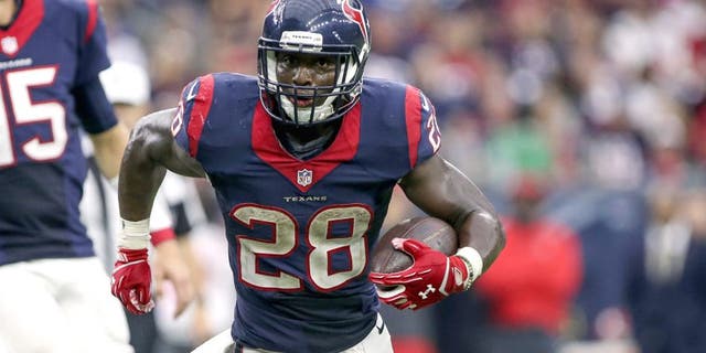 Sep 27, 2015; Houston, TX, USA; Houston Texans running back Alfred Blue (28) rushes during the fourth quarter against the Tampa Bay Buccaneers at NRG Stadium. The Texans defeated the Buccaneers 19-9. Mandatory Credit: Troy Taormina-USA TODAY Sports