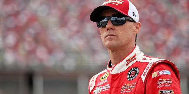 TALLADEGA, AL - OCTOBER 24: Kevin Harvick, driver of the #4 Budweiser/Jimmy John's Chevrolet, stands on the grid during qualifying for the NASCAR Sprint Cup Series CampingWorld.com 500 at Talladega Superspeedway on October 24, 2015 in Talladega, Alabama. (Photo by Patrick Smith/Getty Images)