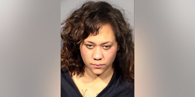 Brina Gomez, 21, was arrested for robbery with a deadly weapon, as authorities are seeking a murder charge for her dead boyfriend, Gustavo Carcamo, 19.