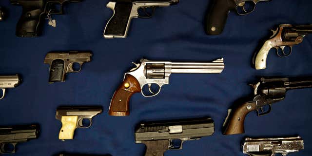 Oct. 27, 2015: Guns seized by the police are displayed during a news conference in New York,