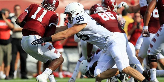 Sep 5, 2015; Philadelphia, PA, USA; Penn State Nittany Lions defensive end Carl Nassib (95) sacks Temple Owls quarterback P.J. Walker (11) during the second quarter at Lincoln Financial Field. Mandatory Credit: Matthew O'Haren-USA TODAY Sports