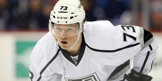 Oct 27, 2015; Winnipeg, Manitoba, CAN; Los Angeles Kings center Tyler Toffoli (73) gets set at the face-off during the first period against the Winnipeg Jets at MTS Centre. Mandatory Credit: Bruce Fedyck-USA TODAY Sports
