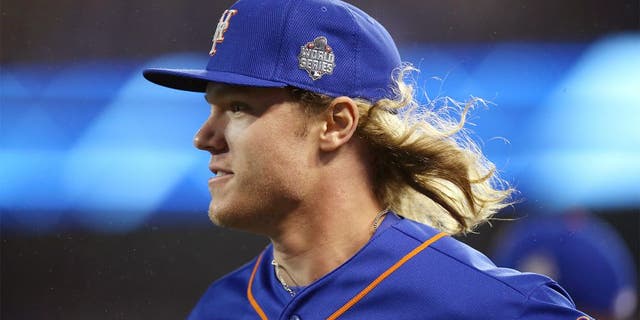 KANSAS CITY, MO - OCTOBER 27: Noah Syndergaard #34 of the New York Mets walks on the field during Game 1 of the 2015 World Series against the Kansas City Royals at Kauffman Stadium on Tuesday, October 27, 2015 in Kansas City, Missouri. (Photo by Brad Mangin/MLB Photos via Getty Images)