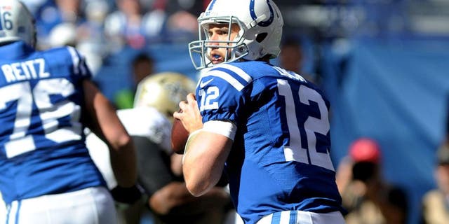Oct 25, 2015; Indianapolis, IN, USA; Indianapolis Colts quarterback Andrew Luck (12) drops back to pass against the New Orleans Saints in the first quarter at Lucas Oil Stadium. Mandatory Credit: Thomas J. Russo-USA TODAY Sports