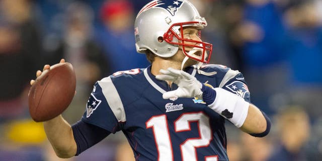 New England Patriots quarterback Tom Brady throws a pass during warm up before they play the Houston Texans in an NFL Monday Night Football game at Gillette Stadium on Monday, Dec. 10, 2012. (Photo by Matthew J. Lee/The Boston Globe via Getty Images)