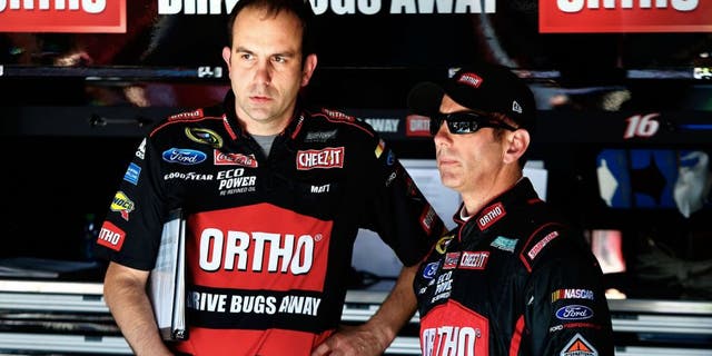 TALLADEGA, AL - MAY 01: Greg Biffle, driver of the #16 Ortho Ford, talks to his crew chief, Matt Puccia, in the garage area during practice for the NASCAR Sprint Cup Series GEICO 500 at Talladega Superspeedway on May 1, 2015 in Talladega, Alabama. (Photo by Jerry Markland/Getty Images)