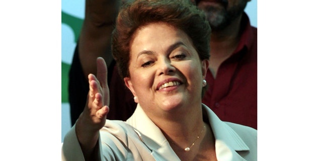 Oct. 31: Brazil's President-elect Dilma Rousseff, of the Workers Party, gestures to supporters as she arrives to give her victory speech after winning the election runoff in Brasilia, Brazil.