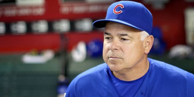 PHOENIX, AZ - JULY 18: Manager Rick Renteria #16 of the Chicago Cubs watches from the dugout during the MLB game against the Arizona Diamondbacks at Chase Field on July 18, 2014 in Phoenix, Arizona. (Photo by Christian Petersen/Getty Images) *** Local Caption *** Rick Renteria