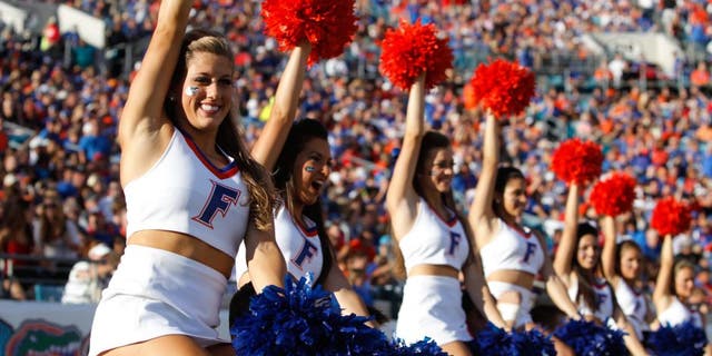 Nov 2, 2013; Jacksonville, FL, USA; Florida Gators cheerleaders cheer against the Georgia Bulldogs during the second quarter at EverBank Field. Mandatory Credit: Kim Klement-USA TODAY Sports
