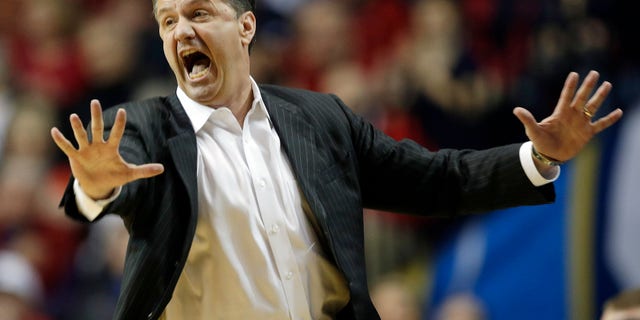 FILE - In this March 15, 2013, file photo, Kentucky head coach John Calipari reacts to a call against the Vanderbilt during the first half of an NCAA college basketball game at the Southeastern Conference tournament in Nashville, Tenn. After a disappointing season that left the Wildcats out of the NCAA tournament, the coach is mindful not to put too much on a recruiting class considered the best in school history. (AP Photo/Dave Martin, File)