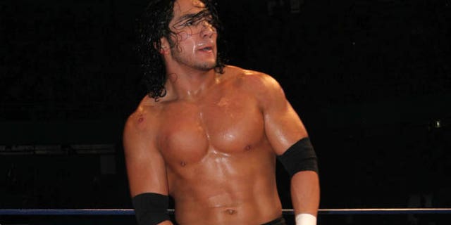 In this April 13, 2007 photo, Mexican wrestler Pedro Aguayo Ramirez, known as Hijo del Perro Aguayo, top, tries to remove the mask of Mistico during a wrestling match in Mexico City. Ramirez, the son of a wrestling legend in the country, died early Saturday March 21, 2015, from a hit suffered in the ring in Tijuana, the Baja California state prosecutor's office said. (AP Photo/Ezequiel Tlaxcala-CUARTOSCURO.COM) MEXICO OUT - NO PUBLICAR EN MEXICO - MANDATORY CREDIT - CREDITO OBLIGATORIO