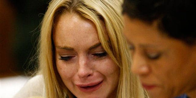 July 6: Lindsay Lohan tearfully reacts as a L.A. judge sentences her to 90 days in jail and 90 in an in-patient rehab facility.