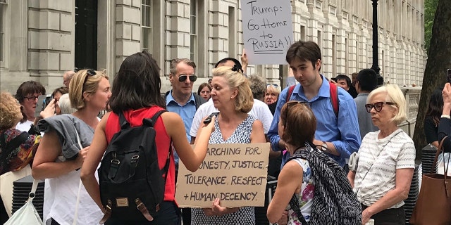 Protesters gather outside 10 Downing Street