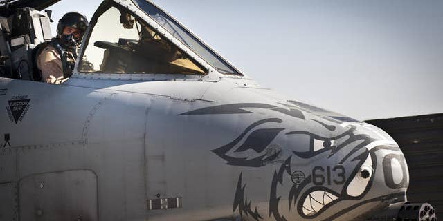 A pilot assigned to the 104th Expeditionary Fighter Squadron prepares an A-10 Thunderbolt II for a 2012 mission in Afghanistan. (Capt. Raymond Geoffroy/U.S. Air Force)