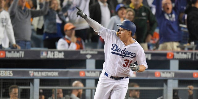 Los Angeles Dodgers' Joc Pederson celebrates his home run off against the Houston Astros during the seventh inning of Game 6 of baseball's World Series Tuesday, Oct. 31, 2017, in Los Angeles