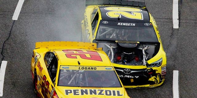 MARTINSVILLE, VA - NOVEMBER 01: Matt Kenseth, driver of the #20 Dollar General Toyota, makes contact with Joey Logano, driver of the #22 Shell Pennzoil Ford, during the NASCAR Sprint Cup Series Goody's Headache Relief Shot 500 at Martinsville Speedway on November 1, 2015 in Martinsville, Virginia. (Photo by Brian Lawdermilk/NASCAR via Getty Images)