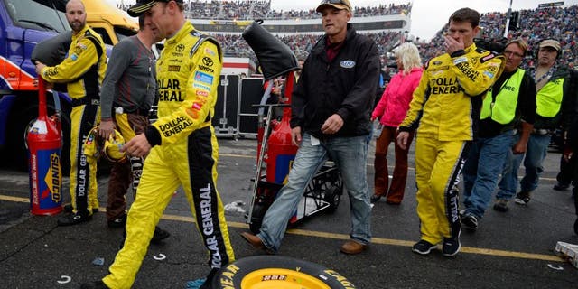 MARTINSVILLE, VA - NOVEMBER 01: Matt Kenseth, driver of the #20 Dollar General Toyota, walks through the garage area after an on-track incident with Joey Logano during the NASCAR Sprint Cup Series Goody's Headache Relief Shot 500 at Martinsville Speedway on November 1, 2015 in Martinsville, Virginia. (Photo by Robert Laberge/Getty Images)