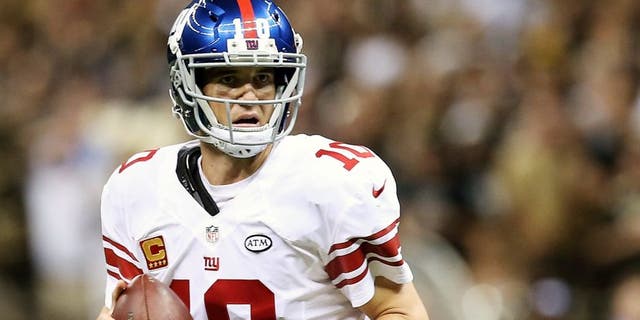 NEW ORLEANS, LA - NOVEMBER 01: Eli Manning #10 of the New York Giants looks to pass on fourth down during the fourth quarter of a game against the New Orleans Saints at the Mercedes-Benz Superdome on November 1, 2015 in New Orleans, Louisiana. (Photo by Sean Gardner/Getty Images)