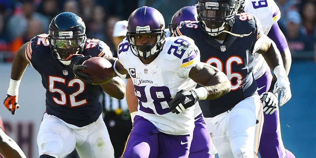 Nov 1, 2015; Chicago, IL, USA; Minnesota Vikings running back Adrian Peterson (28) carries the ball against the Chicago Bears during the first half at Soldier Field. Mandatory Credit: Mike DiNovo-USA TODAY Sports