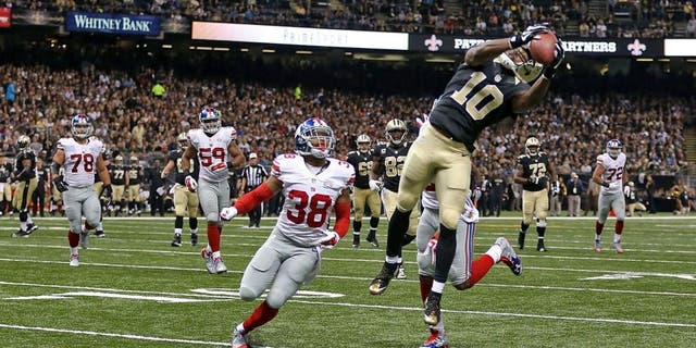 NEW ORLEANS, LA - NOVEMBER 01: Brandin Cooks #10 of the New Orleans Saints catches a pass for a touchdown during the third quarter of a game against the New York Giants at the Mercedes-Benz Superdome on November 1, 2015 in New Orleans, Louisiana. (Photo by Chris Graythen/Getty Images)