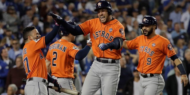 Houston Astros' George Springer reacts after hitting a two-run home run during the second inning of Game 7 of baseball's World Series against the Los Angeles Dodgers Wednesday, Nov. 1, 2017, in Los Angeles.