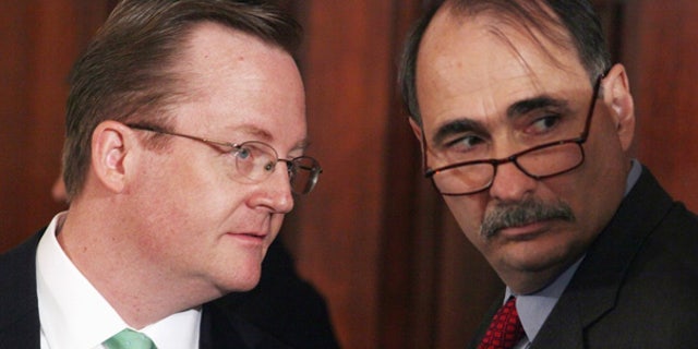 Sept. 10: White House Press Secretary Robert Gibbs confers with President Obama Senior Adviser David Axelrod in the White House.